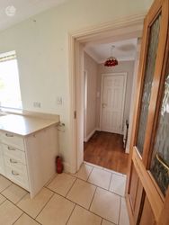 Back Hall to Utility Closet and TV Lounge